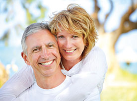 Photo of a couple smiling. Link to Life Stage Gift Planner Under Age 60 Situations.