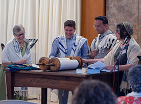 Four people having a bat mitzvah ceremoney. Links to Gifts from Retirement Plans